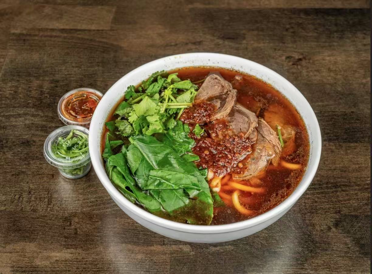 Spicy soup with braised beef, noodles & fresh greens at Village Bao 又一村包子，a Chinese Restaurant in Sugar Land